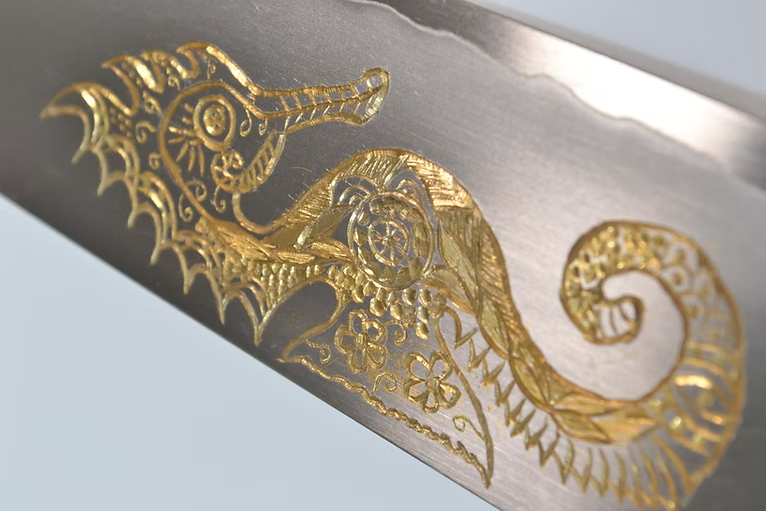Sakai Takayuki Gold Filled Engraving by Kubota Seahorse Silver Steel No.3 Santoku 180mm Ebony Wood (ferrule: Black Water Buffalo Horn And Silver Ring) Handle - Japanny - Best Japanese Knife