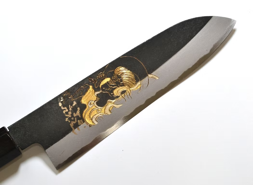 Sakai Takayuki Gold Filled Engraving by Kubota Fūjin White Steel No.2 Black Finished Santoku 180mm Ebony Wood (ferrule: Black Water Buffalo Horn And Silver Ring) Handle - Japanny - Best Japanese Knife