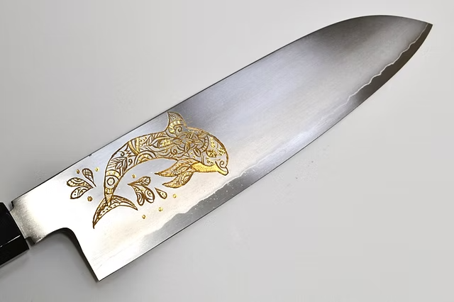Sakai Takayuki Gold Filled Engraving by Kubota Dolphin Silver Steel No.3 Santoku 180mm Ebony Wood (ferrule: Black Water Buffalo Horn And Silver Ring) Handle - Japanny - Best Japanese Knife