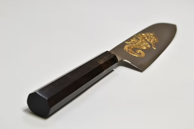 Sakai Takayuki Gold Filled Engraving by Kubota Seahorse Silver Steel No.3 Santoku 180mm Ebony Wood (ferrule: Black Water Buffalo Horn And Silver Ring) Handle - Japanny - Best Japanese Knife